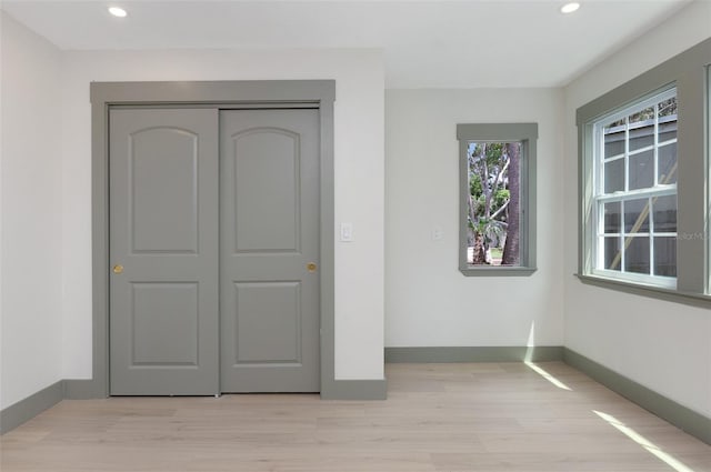 1320 Coral Way S, Saint Petersburg, FL 33705 - unfurnished bedroom with light wood-type flooring, recessed lighting, and a closet