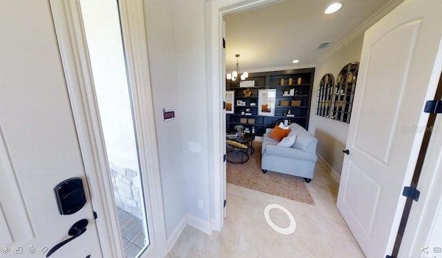1904 146th Ter E, Parrish, FL 34219 - interior space featuring visible vents, built in shelves, baseboards, a notable chandelier, and ornamental molding
