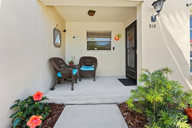 2700 Bayshore Blvd Unit 512, Dunedin, FL 34698 - view of exterior entry with stucco siding