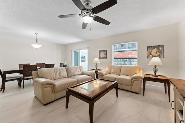 2700 Bayshore Blvd Unit 512, Dunedin, FL 34698 - living area with ceiling fan and a textured ceiling