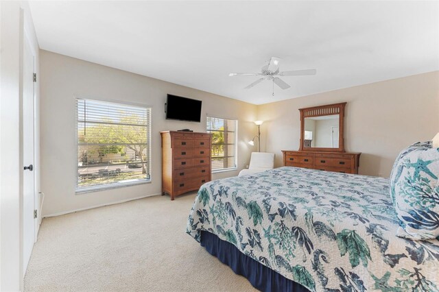 2700 Bayshore Blvd Unit 512, Dunedin, FL 34698 - bedroom with light carpet and ceiling fan