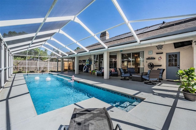 view of pool with a patio, fence, a fenced in pool, a lanai, and an outdoor hangout area