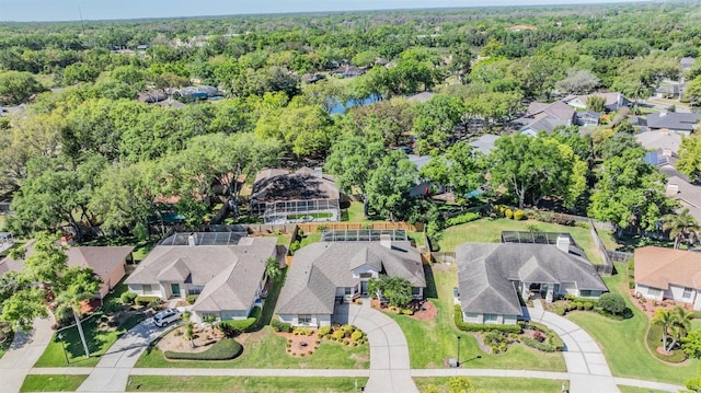 aerial view featuring a residential view and a wooded view