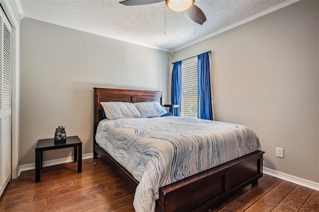 bedroom with baseboards, a textured ceiling, crown molding, and hardwood / wood-style flooring