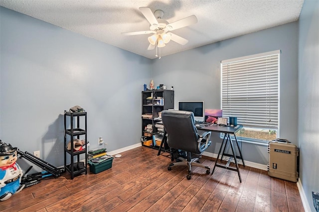 office space with baseboards, wood-type flooring, a textured ceiling, and ceiling fan