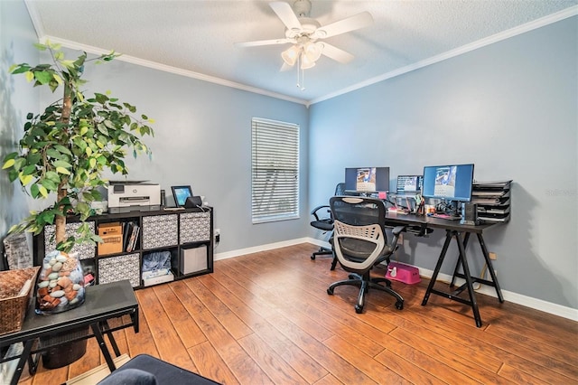 office space with a ceiling fan, crown molding, wood finished floors, and baseboards