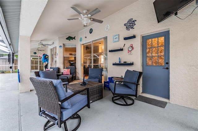 view of patio with ceiling fan, outdoor lounge area, and fence