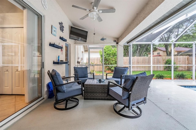 view of patio with a ceiling fan, a lanai, fence, and an outdoor hangout area