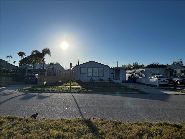 view of front of property featuring fence