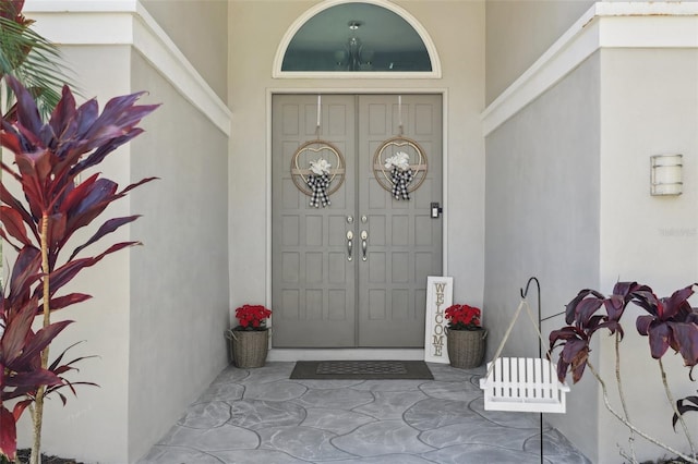 954 Cobblestone Ln, Tarpon Springs, FL 34688 - property entrance with stucco siding