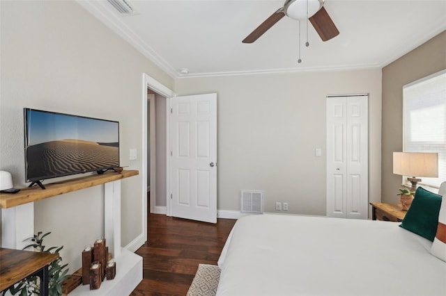 954 Cobblestone Ln, Tarpon Springs, FL 34688 - bedroom featuring crown molding, a closet, visible vents, and wood finished floors