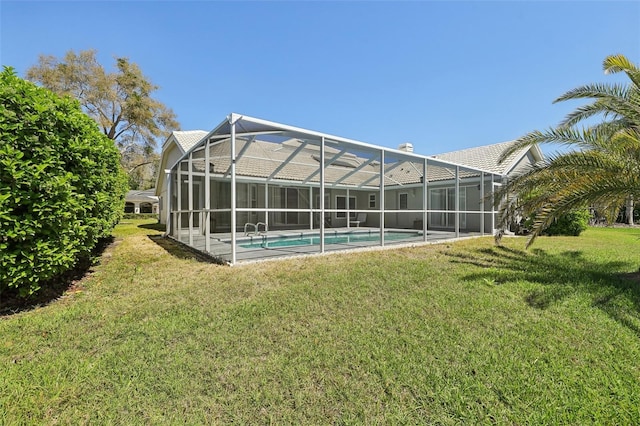 954 Cobblestone Ln, Tarpon Springs, FL 34688 - back of house featuring an outdoor pool and a yard