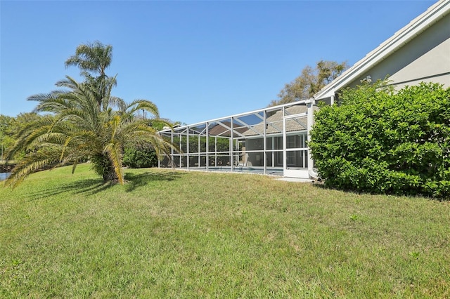 954 Cobblestone Ln, Tarpon Springs, FL 34688 - view of yard with a lanai