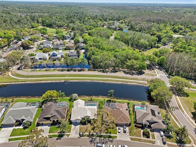 954 Cobblestone Ln, Tarpon Springs, FL 34688 - aerial view featuring a water view, a forest view, and a residential view