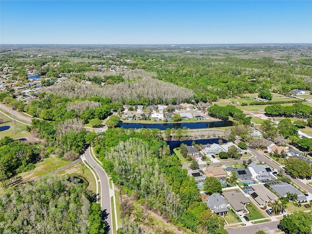 954 Cobblestone Ln, Tarpon Springs, FL 34688 - bird's eye view featuring a residential view, a water view, and a view of trees