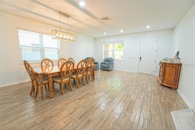 dining area featuring light wood-style flooring, recessed lighting, baseboards, and visible vents