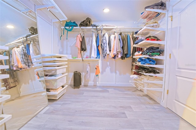 spacious closet with wood finished floors