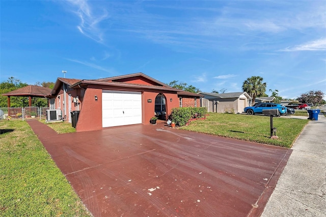 10035 Cherry Creek Ln, Port Richey, FL 34668 - ranch-style home featuring stucco siding, a front lawn, fence, concrete driveway, and an attached garage