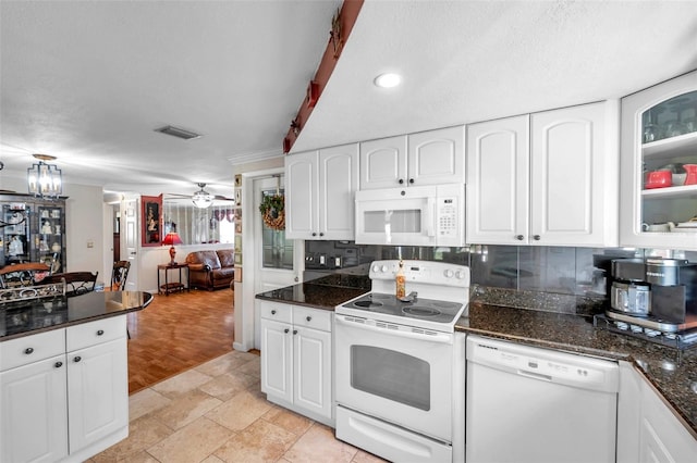 10035 Cherry Creek Ln, Port Richey, FL 34668 - kitchen with visible vents, white appliances, ceiling fan, and white cabinets
