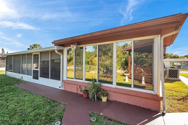 10035 Cherry Creek Ln, Port Richey, FL 34668 - exterior space featuring a yard, fence, and a sunroom