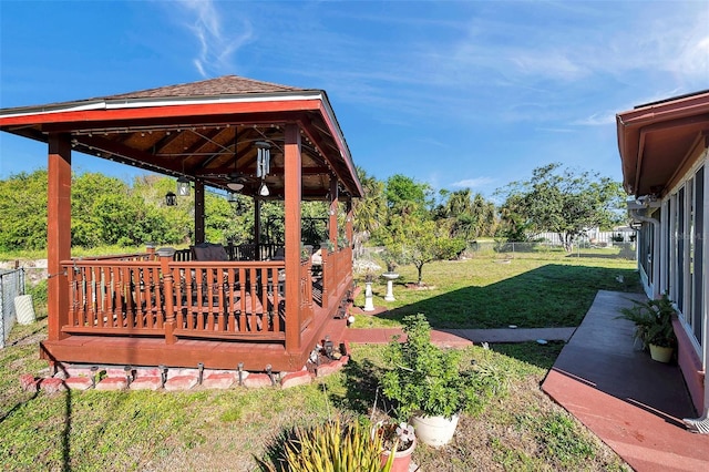 10035 Cherry Creek Ln, Port Richey, FL 34668 - view of yard with a gazebo, a wooden deck, and fence