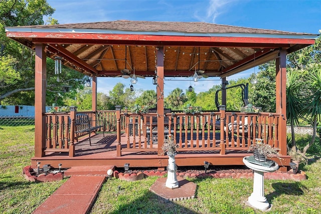 10035 Cherry Creek Ln, Port Richey, FL 34668 - deck with a gazebo, a lawn, and fence