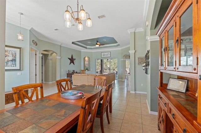 16340 Marquis Rd, Brooksville, FL 34614 - dining space featuring visible vents, arched walkways, a raised ceiling, and ornate columns