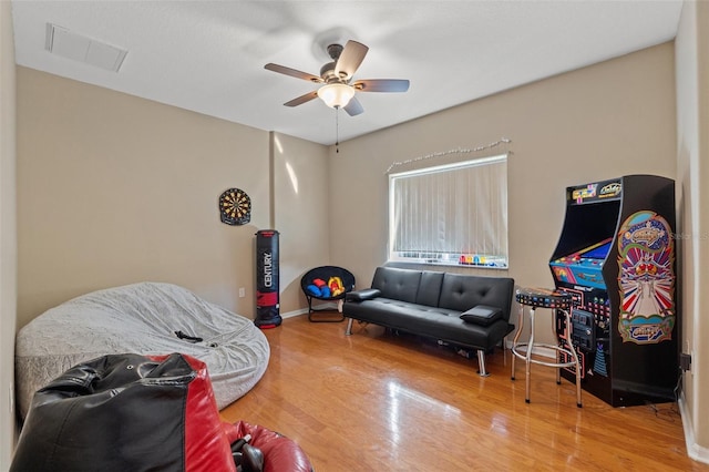16340 Marquis Rd, Brooksville, FL 34614 - rec room featuring a ceiling fan, wood finished floors, visible vents, and baseboards