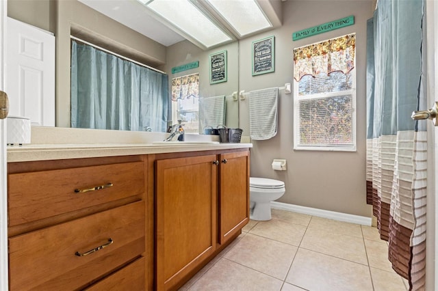 16340 Marquis Rd, Brooksville, FL 34614 - full bathroom with tile patterned flooring, toilet, vanity, and baseboards