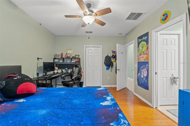 16340 Marquis Rd, Brooksville, FL 34614 - bedroom with ceiling fan, visible vents, baseboards, and wood finished floors