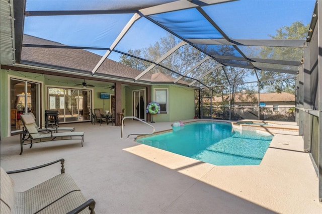 16340 Marquis Rd, Brooksville, FL 34614 - view of pool featuring a patio area, glass enclosure, a pool with connected hot tub, and a ceiling fan