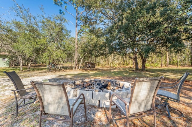 16340 Marquis Rd, Brooksville, FL 34614 - view of patio with an outdoor fire pit