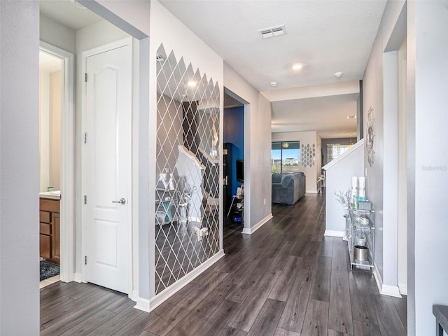 7494 Pool Compass Loop, Wesley Chapel, FL 33545 - corridor with dark wood-style floors and baseboards