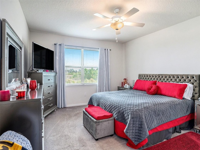 7494 Pool Compass Loop, Wesley Chapel, FL 33545 - carpeted bedroom with baseboards, ceiling fan, and a textured ceiling