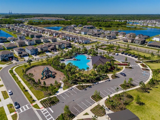 bird's eye view featuring a residential view and a water view