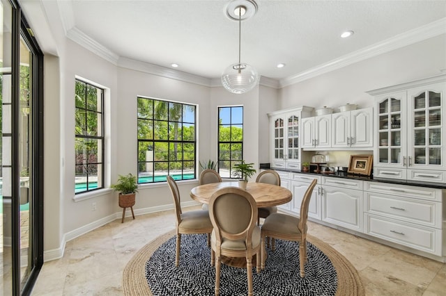 dining space with crown molding, recessed lighting, and baseboards