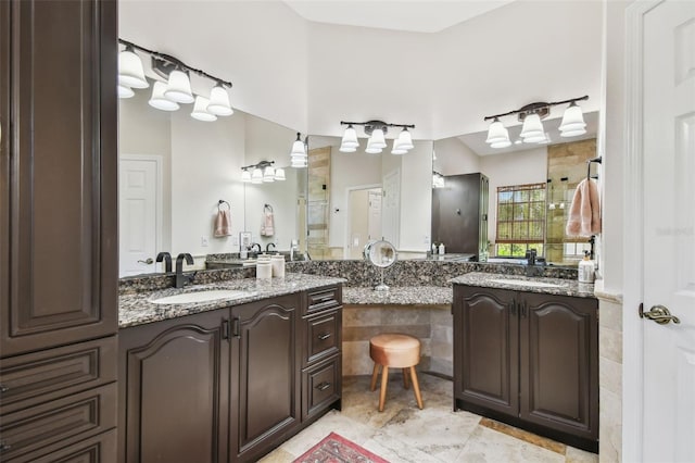 full bath featuring two vanities and a sink
