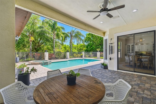 view of swimming pool with a fenced backyard, ceiling fan, outdoor dining area, and a patio