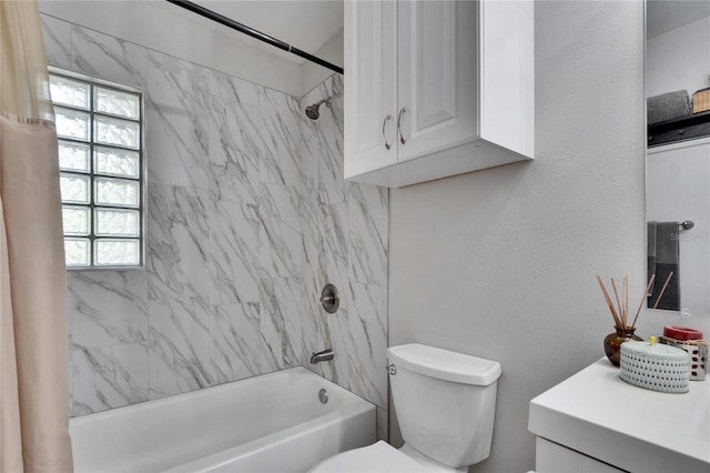 full bathroom featuring toilet, plenty of natural light, shower / bathing tub combination, and vanity