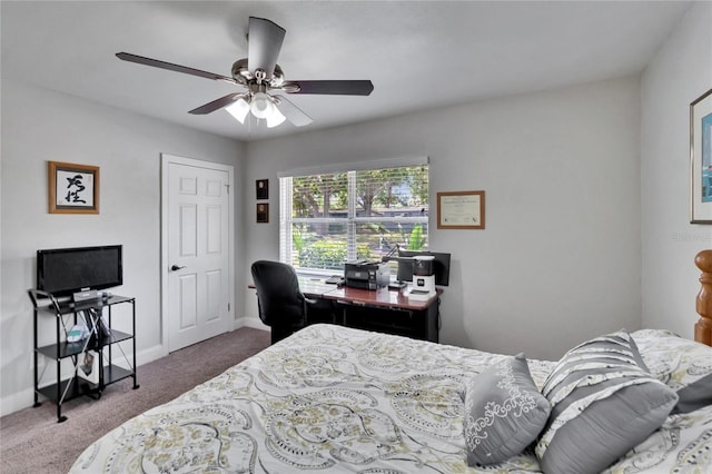 carpeted bedroom with baseboards and ceiling fan