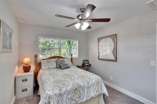 bedroom with carpet flooring, ceiling fan, and baseboards