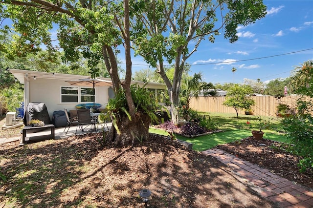 view of yard featuring a patio and fence
