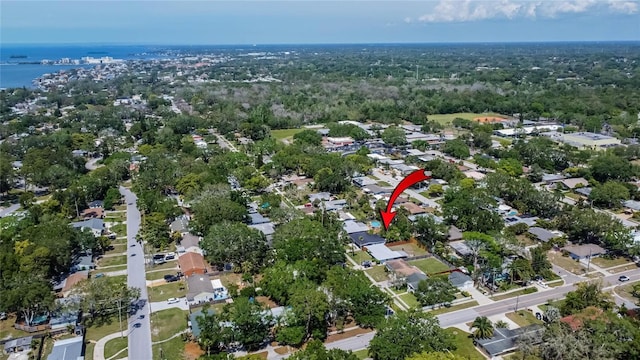 birds eye view of property featuring a water view and a residential view