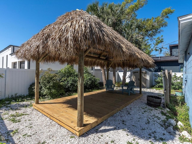 4500 23rd Ave S, Saint Petersburg, FL 33711 - surrounding community with a wooden deck, a fenced backyard, an outbuilding, and a storage shed