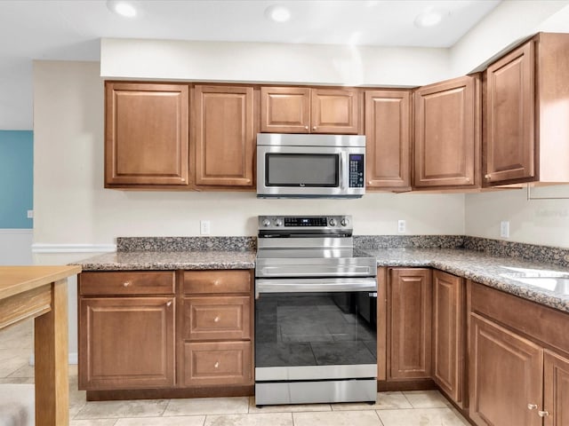 4500 23rd Ave S, Saint Petersburg, FL 33711 - kitchen with stainless steel appliances, recessed lighting, and brown cabinetry