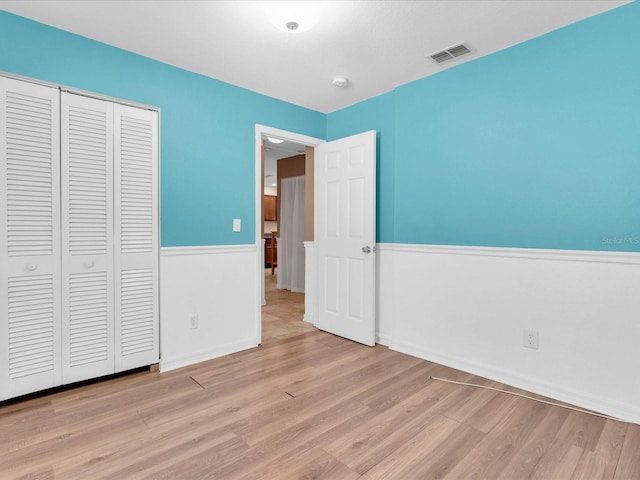 4500 23rd Ave S, Saint Petersburg, FL 33711 - unfurnished bedroom with a closet, wood finished floors, visible vents, and baseboards