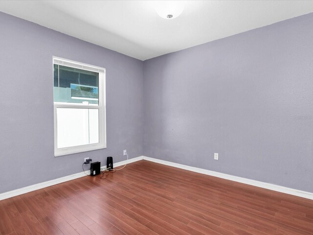 4500 23rd Ave S, Saint Petersburg, FL 33711 - empty room featuring baseboards and wood finished floors