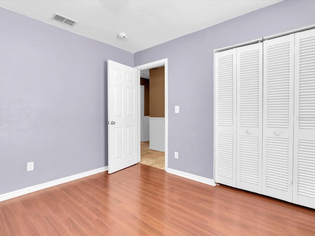 4500 23rd Ave S, Saint Petersburg, FL 33711 - unfurnished bedroom with baseboards, wood finished floors, and visible vents