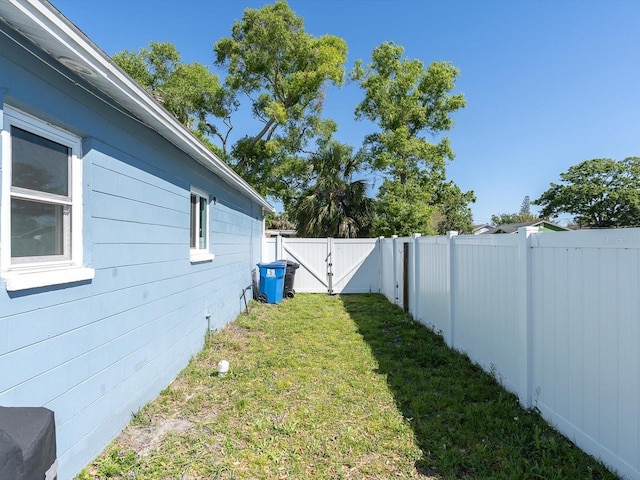 4500 23rd Ave S, Saint Petersburg, FL 33711 - view of yard featuring a fenced backyard and a gate