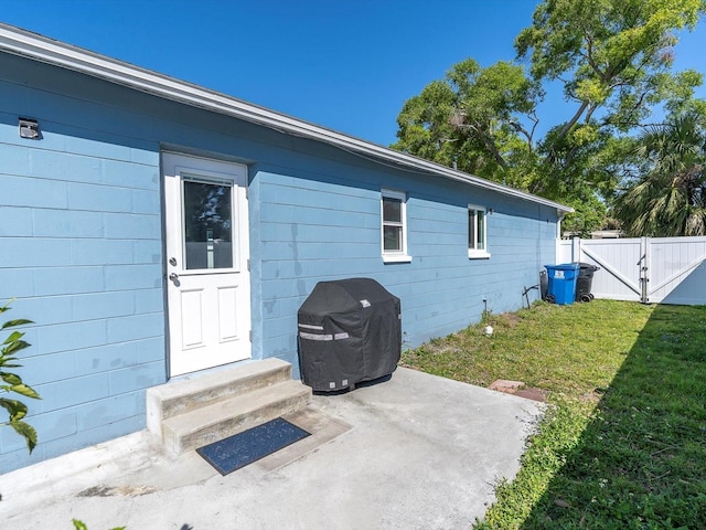 4500 23rd Ave S, Saint Petersburg, FL 33711 - exterior space with fence, a lawn, entry steps, and concrete block siding